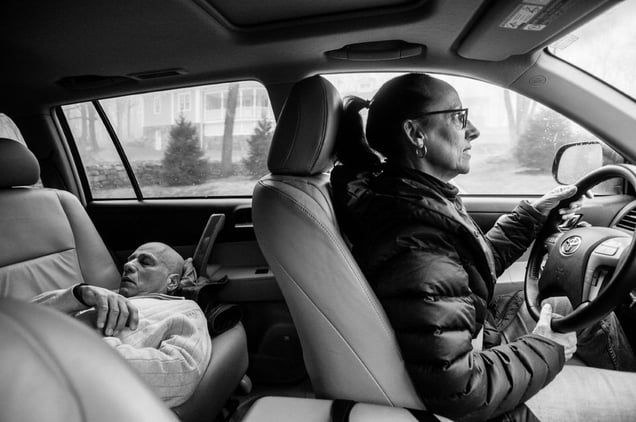 The drive to chemotherapy treatment takes half an hour, and Howie and Laurel Borowick take turns, resting and driving, depending on whose getting treatment that day. Greenwich, Connecticut. January, 2013 © Nancy Borowick