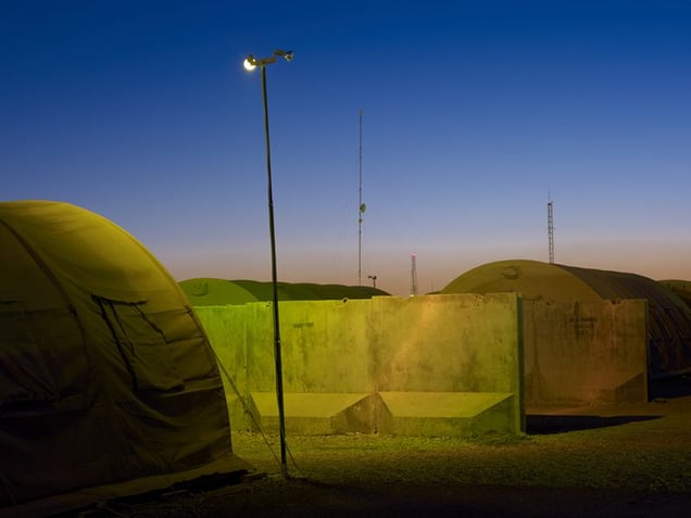 Security lights and communications antennae at Camp Leatherneck. © Simon Norfolk.