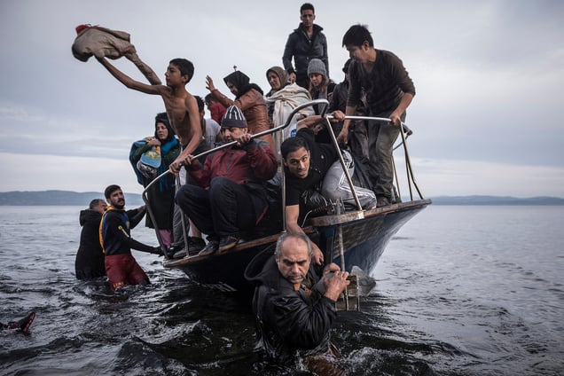 Refugees arrive by boat near the village of Skala on Lesbos, Greece, 16November 2015.