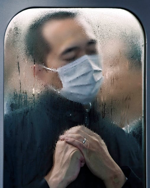 From the series "Tokyo Compression," a series of candid portraits of Japanese commuters enduring the inhuman daily crush of bodies in Tokyo’s subway cars.