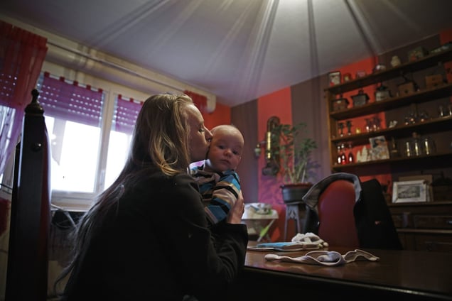 Laurine (17) and her son ThimÈo (4 months). They live with Laurineís father in Fourmies. January 2015. © Viviane Dalles
