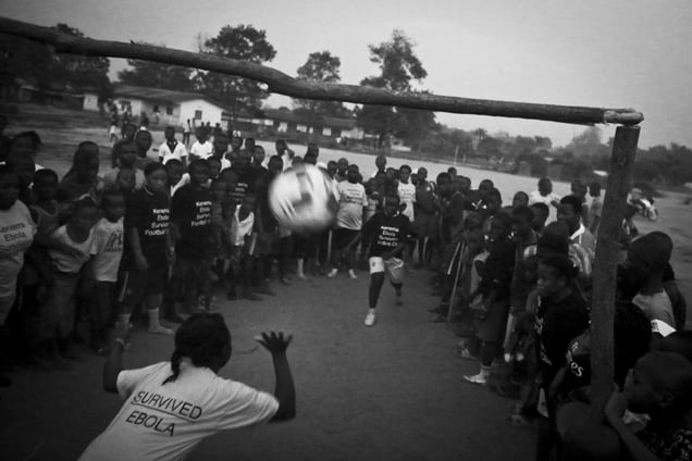 Prison Turây, centre right, helps referee a practice game with female members of the Ebola Survivors Football Club in the city of Kerema, Sierra Leone, 21 April2015.