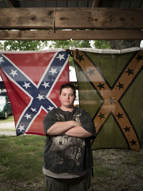Amy Gentry sells Confederate themed merchandise in her booth at the Rabun Flea Market in Rabun Gap, GA. © Forest McMullin