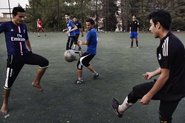 Young IDPs from Falluja play football in the evening. They organize themselves in teams and play several times a week. 25/08/15. Shaqlawa, Iraq.