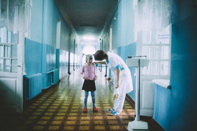The girl is crying in front of people with TB injections. Tsurupinsk children’s TB hospital, September 2011.