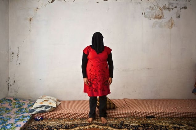 Faqaa, Lebanon. Sayyidah, 23 years old, from Qusayr, where her husband used to run a petrol station and make 2,000 USD per month. Their nice villa was destroyed  they decided to leave. During the trip, two of her friends were killed by snipers right in front of her eyes. Shocked by the event, she is now unable to talk about anything related to the war. © Matilde Gattoni