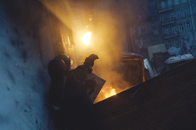 Protester through a Molotov cocktail to riot police during clashes on Maidan. Kiev, Jan. 20, 2014