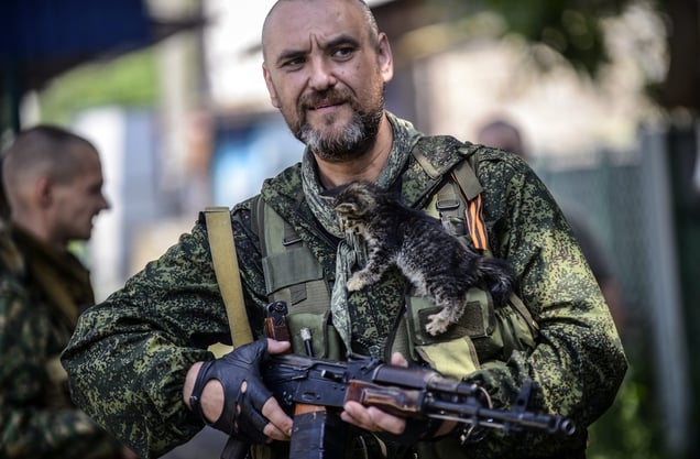 Northern Donetsk, July 22, 2014. A pro-Russian separatist at a checkpoint. Terrified civilians had fled clashes between Ukrainian government troops and pro-Russian rebels that killed at least four people on the outskirts of the insurgent stronghold of Donetsk. © Bülent Kiliç / AFP