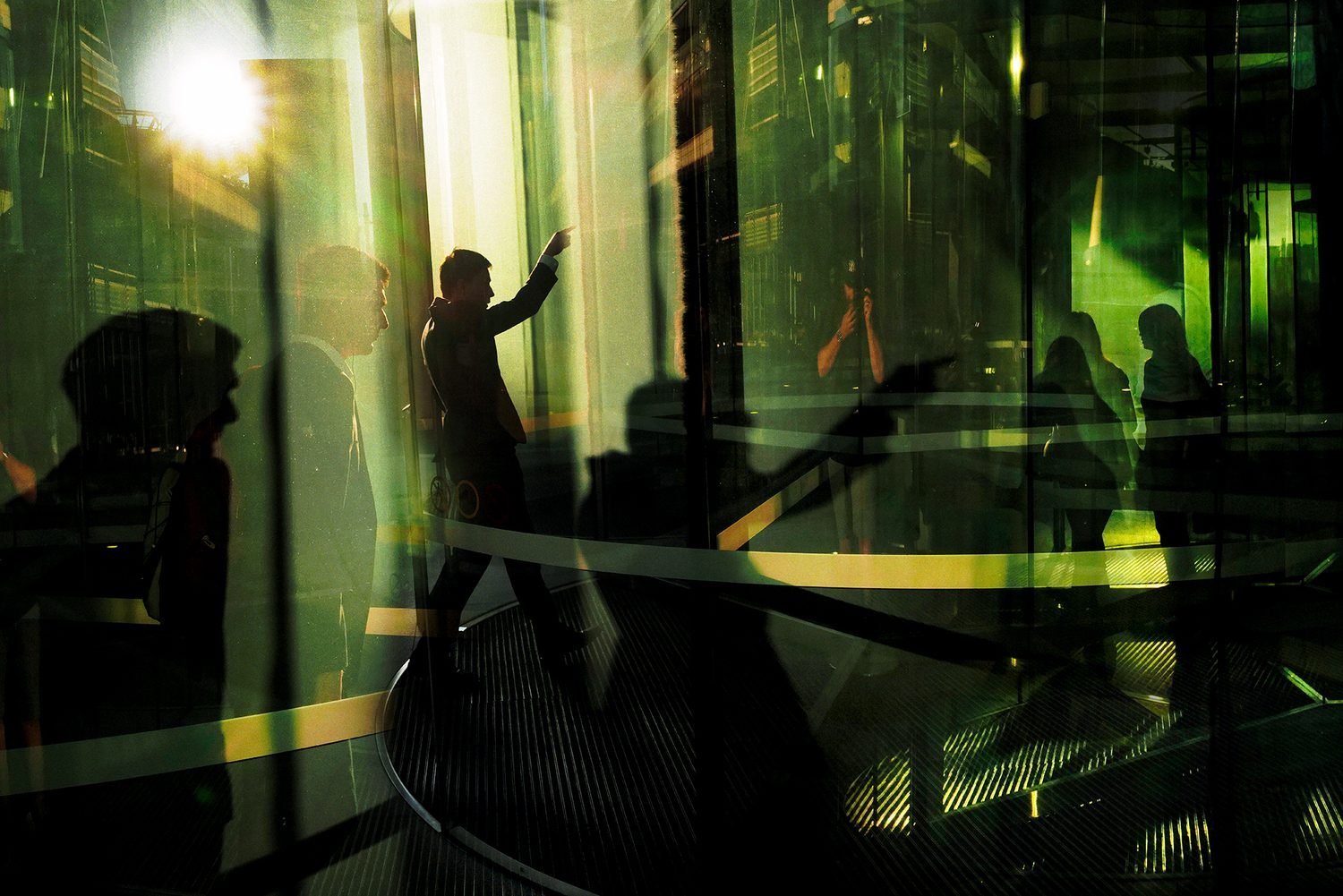 Hold Up. The glass surfaces of the shiny, new office buildings at Sydney’s recently developed Barangaroo precinct provide a dramatic setting for street photography. In Aboriginal history, Barangaroo was a powerful Cammeraygal woman of the Eora Nation and a key figure in local Aboriginal culture and community. Commenced in 2011, the 22 hectare precinct consists of towering office buildings, a 270m tall casino and hotel, restaurants, bars, and tourist attractions. According to census data, the population of this area stands at 186. © Sam Ferris