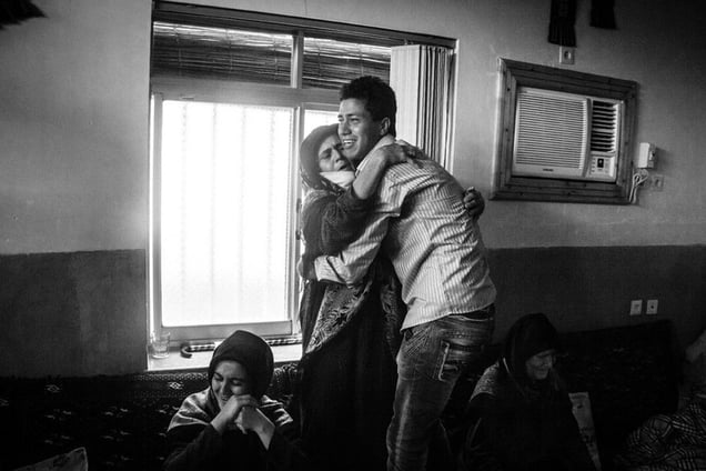 ibi Paqeh, mother of martyr Yahya Paqeh, waits for the body of her son to be returned for burial. Yahya’s body was found and identified 26 years after he went missing in action_ Gorgan