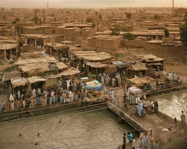 Afghan Refugees living at Kacha Garhi Camp, near to Peshawar, Pakistan. From "Forensic Traces of War" © Simon Norfolk