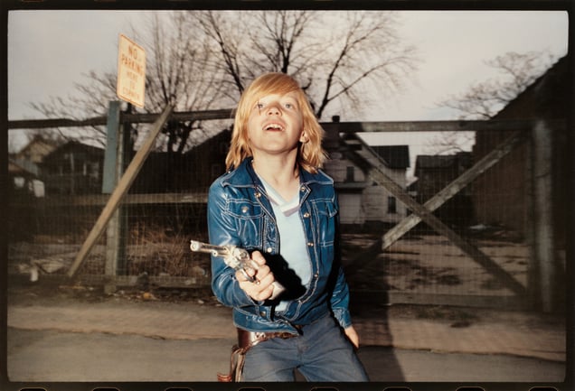Flashed Boy in Blue Jacket with Six-Shooter