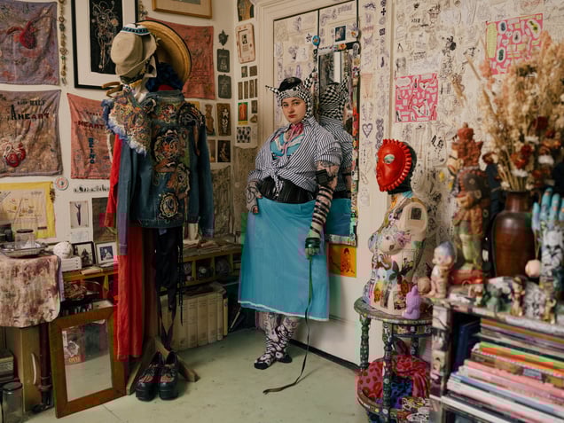 Lois wearing a Jewish Tefillin while dressing up in her room