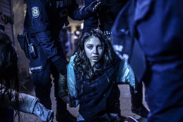 Girl wounded during clashes between riot police and protestors, Istanbul, 12 March. Spot News Singles, 1st place. Bulent Kilic, Turkey, Agence France-Presse.