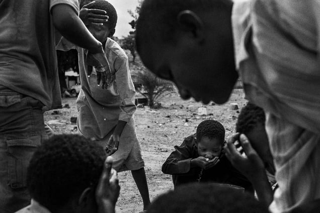 Former talibes cool off at SOS Talibe Centre in Bafata, Guinea-Bissau, where they are now taken care of by a charity. 8 June 2015.