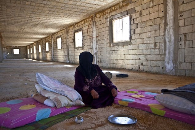 Jdeideh, Lebanon. Wurud, 50 years old, comes from Zahra. She arrived four months ago with all her family of 22 people, after the Syrian security forces set up a checkpoint close to her house to clash against nearby positions of the Free Syrian Army. "One day they opened fire on both sides of our house. I went out and ran through the fields with my children. © Matilde Gattoni