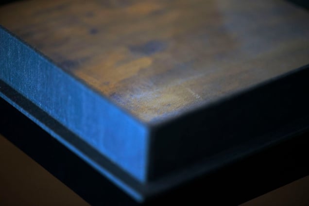 An important design element for Maruschak is color.  She hand dyed the leather for this artist proof to match the fabric.