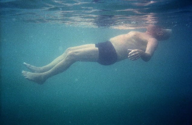 Georgia, Pitsunda, AbkhaziaA man swims in the Black Sea near Pitsunda.© Petrut Calinescu