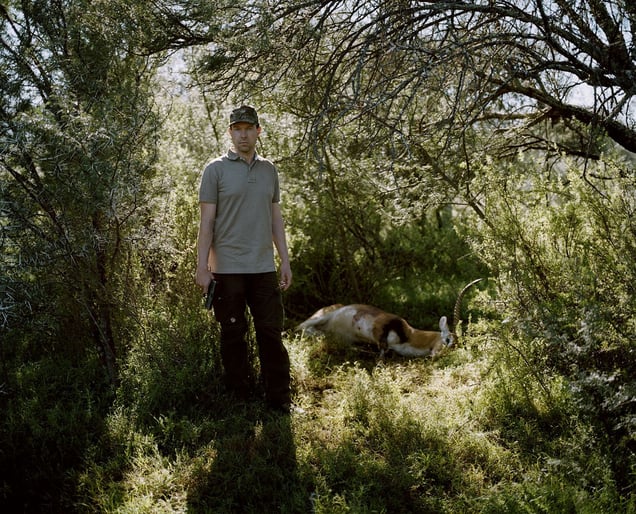 untitled hunter, hand gun and lechwe, eastern cape, south africa-from the series 'hunters'-David Chancellor