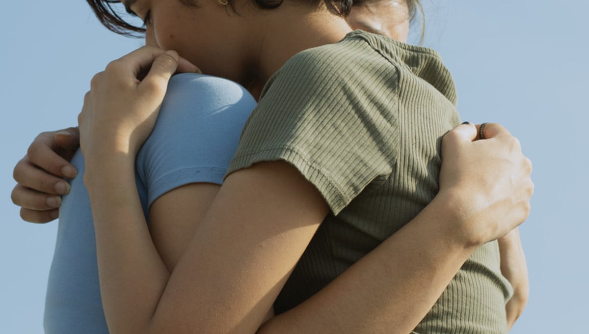 Deivina and Nivedita embrace
