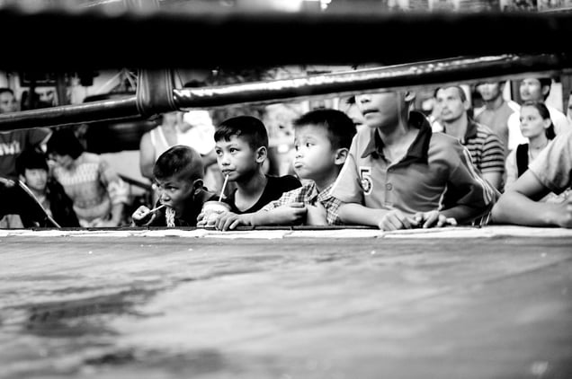 Young boys are watching a boxing match. Sometimes they fight also. © Sandra Hoyn