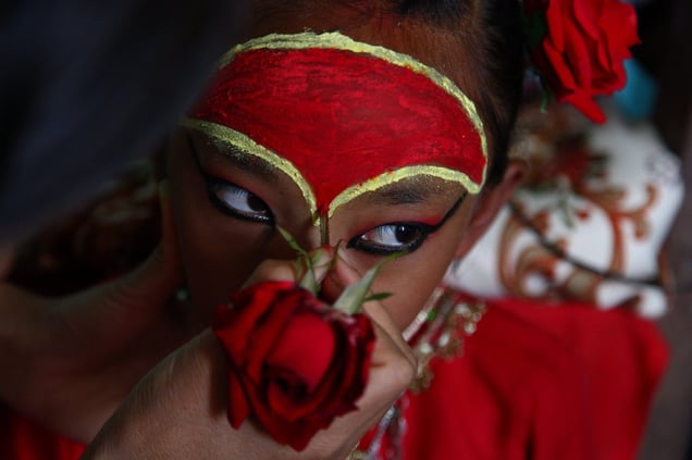 Kumari Dangol with special festive make-up. It is not just outside appearances that change for festivals; former Kumaris say they felt bigger and stronger, and could feel heat radiating from their foreheads. © Stephanie Sinclair for National Geographic Magazine