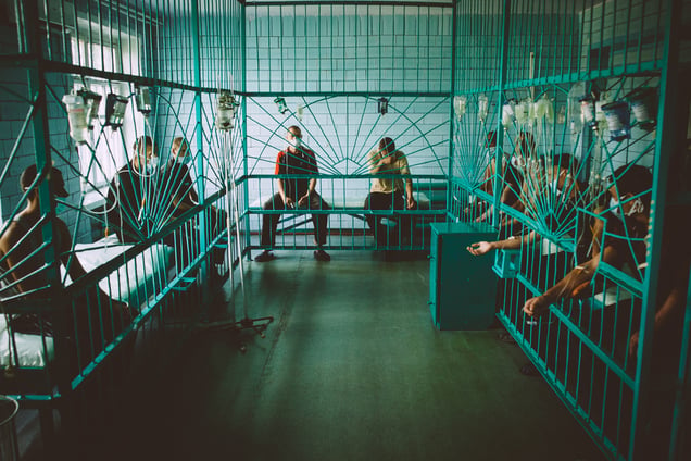 Prisoners with droppers in the treatment room of the TB department in a prison.Starozburevska penal colony #7, July  2011.