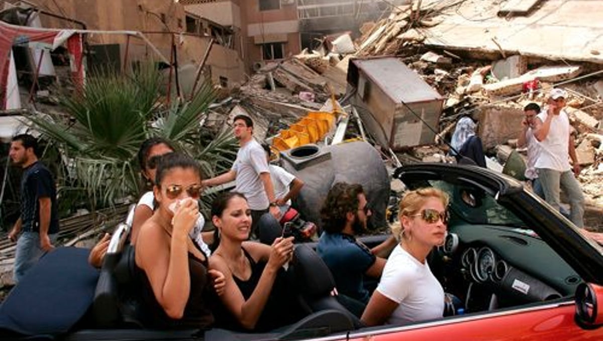 World Press Photo of the Year 2006, © Spencer Platt, USA, Getty Images, Young Lebanese drive through devastated neighborhood of South Beirut, 15 August