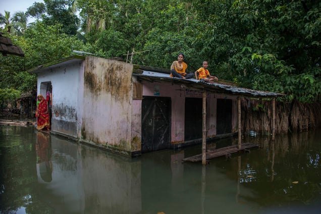 A family trapped in the flood water at Tala, Satkhira, Bangladesh