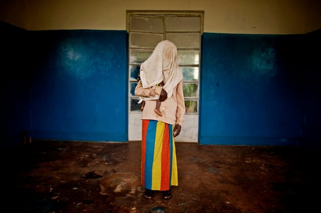 A victim of a mass rape campaign in the town of Fizi, Democratic Republic of Congo. Her identity has been concealed for security reasons and because rape carries strong social stigma. She was among nearly fifty women who were raped during a campaign by Congolese soldiers that took place on the night of January 1st 2011.