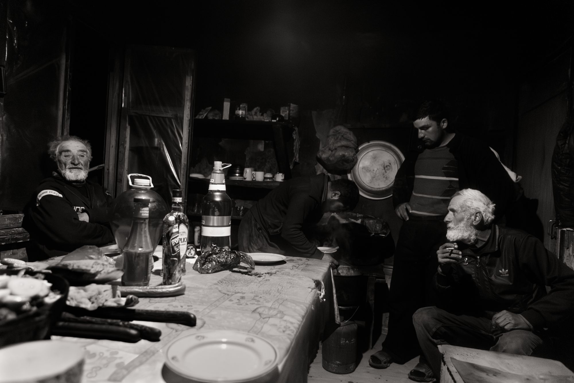 Sheep drive Vashlovani, Georgia. Shepherds in their hut which is their home for the winter © Maurice Wolf