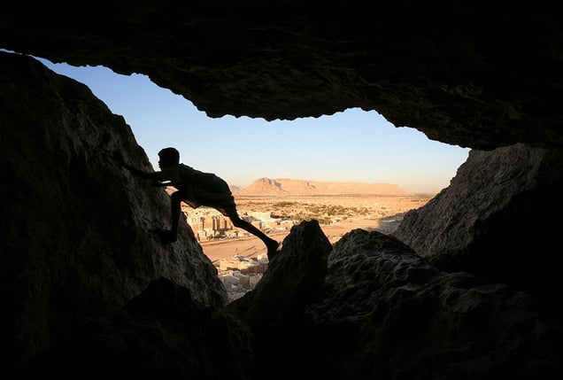 Shibam, Yemen: A young boy plays in a cave above the historic town. © Matjaz Krivic