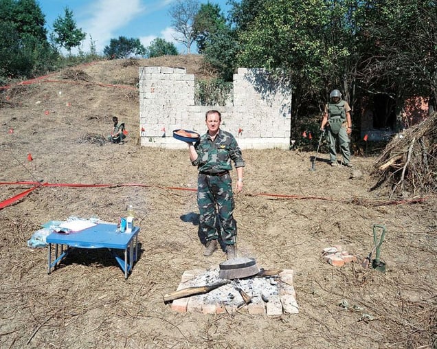 Army Cooks, Croatia, 2007. If we happen to stray into a minefield while catching a calf, we keep a safe distance and follow in its footsteps until it returns to the paved street. In that moment we catch the calf, lead it into the stockade, kill it and cut it into pieces. © Martin Kollar.