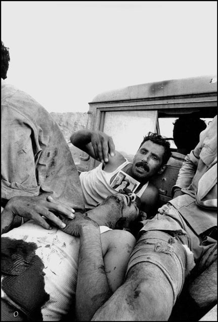 Iraqi P.O.W. holds the picture of Ayatollah Khomeini, leader of the Iran revolution during the battle of Khoramshar  1982
© Copyright 1979-2009 Alfred Yaghobzadeh. All rights reserved.