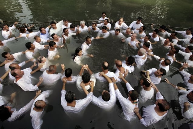 Jordan River, Sep 07 - Evangelic priests performing a group baptism ceremony © Natan Dvir