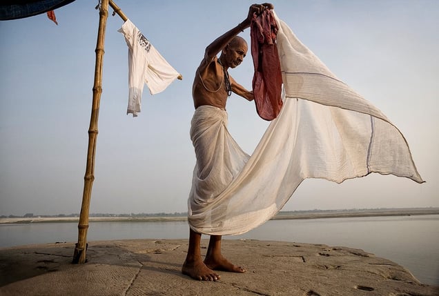 Varanasi, India: The man alongside the holy Ganges is getting ready for the funeral of his relative, who will be cremated on the most sacred Hindu place. © Matjaz Krivic