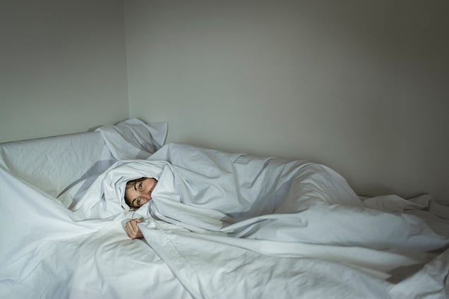 Ilaria, 45, in her house in Besnate (Lombardy) wrapped in a shielding sheet that protects her during the night.