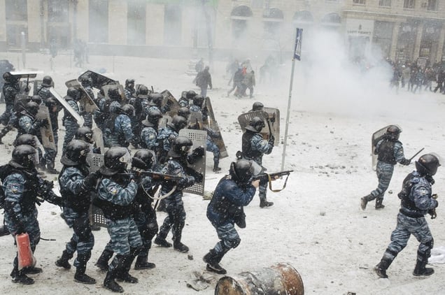 Riot police went on the offensive against protesters using pump guns and stun grenades during the attempt of a crackdown on Hrushevskoho street in central Kiev Jan. 22, 2014.