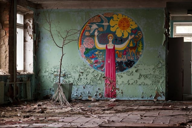 Pripyat, Ukraine, 2005. The peeling murals of an abandoned school offer just one example of the scenes of death and decay in the city. The atmosphere is one continuous poignant reminder that tens of thousands of people once called Pripyat home.