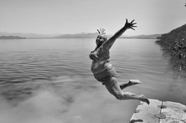 A muddy face from the mud bath going into the lake © Alpay Erdem, Turkey. Shortlist, Smile category, Open Competition. 2014 Sony World Photography Awards