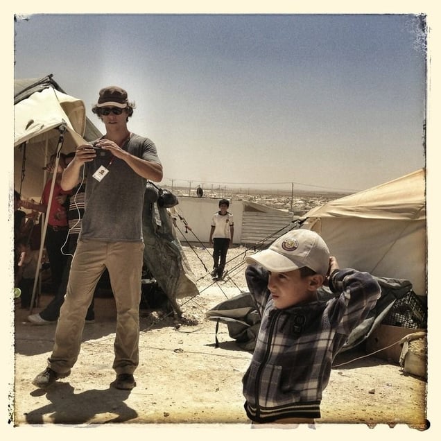 Michael Christopher Brown takes a picture on his iphone.