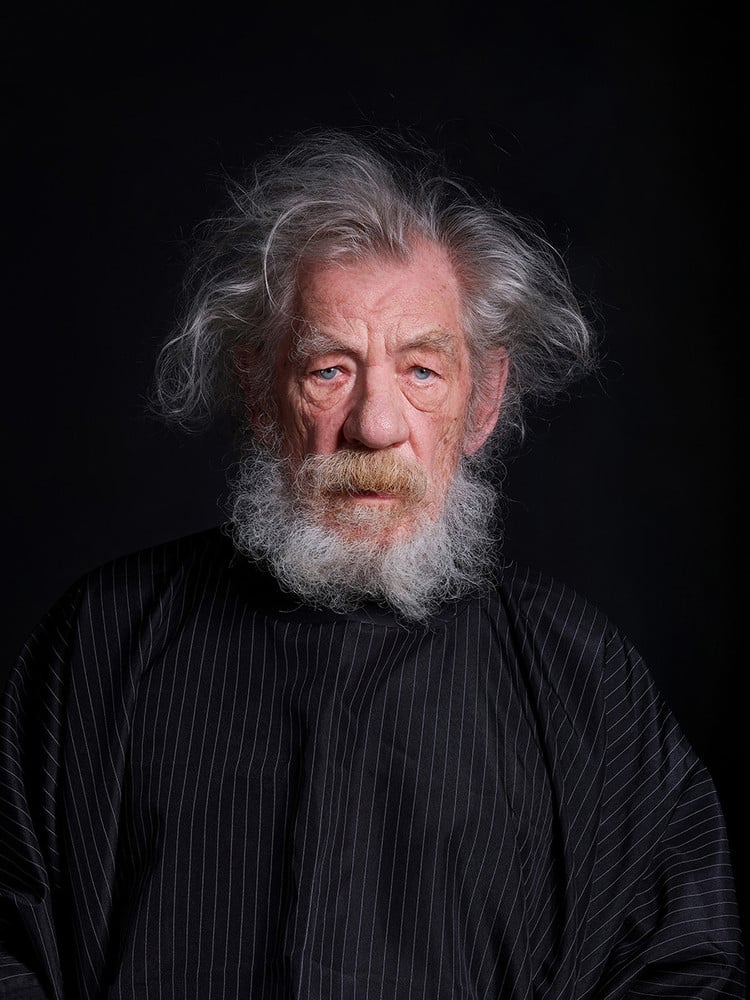 The Haircut 1. Due to an accident on stage in June 2024, 85 year old actor Ian McKellen had no choice but to leave mid-way through a West End run of Shakespeare's 'Henry IV, Parts 1 & 2' in which he played the role of scoundrel John Falstaff. This iconic role was one of the few major Shakespearean parts which McKellen had never attempted before, and one which he had waited years to perform, letting his hair and beard grow out for nearly a year in the process. While the production continued in his absence for a further five weeks, McKellen took time to recover at home and waited until the end of the production to finally step out of character. On the 26th of July 2024 after 101 performances on the final day of the play, Ian McKellen was photographed alone at home, receiving the haircut that would allow him to fully recover from John Falstaff. © Frederic Aranda