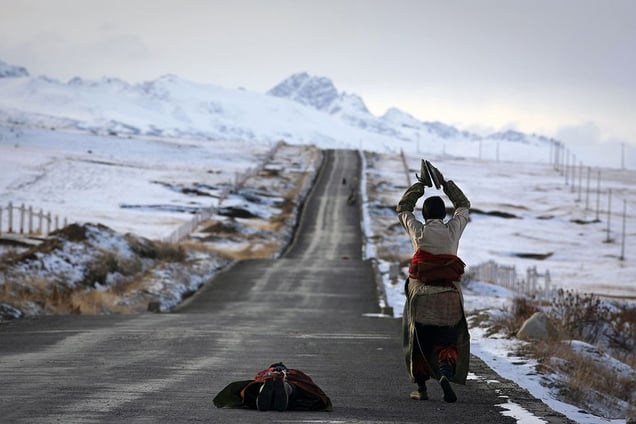 Derge, East Tibet, China: Pilgrims prostrating on their long way to Lhasa. © Matjaz Krivic