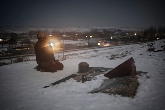 Kostya at the bottom of the mountain. The stone has a scripture, it says, "Stop and pray, because you are entering the mountain of consciousness."
From the series Apashka by © Pavel Prokopchik