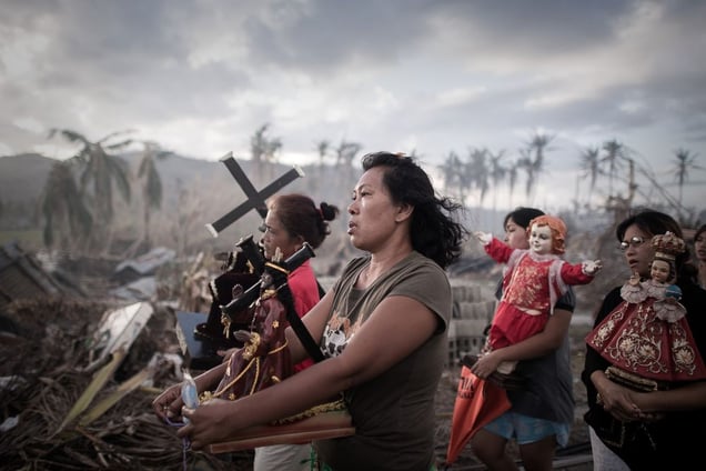 1st Prize Spot News Single. Survivors of typhoon Haiyan march during a religious procession in Tolosa, on the eastern island of Leyte. One of the strongest cyclones ever recorded, Haiyan left 8,000 people dead and missing and more than four million homeless after it hit the central Philippines © Phillipe Lopez, France, Agence France-Presse