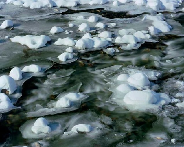 The River Drinjaca between Kladanj and Vlasenica. The Serbs separated women and children from the other Bosniac captives and bussed them to Bosnian Government-held territory. Near this location the buses were stopped, the men were separated off and then killed in an isolated field. From "Forensic Traces of War" © Simon Norfolk
