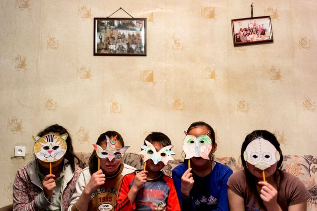 The Orphans Masquerade, showing off what they made earlier.