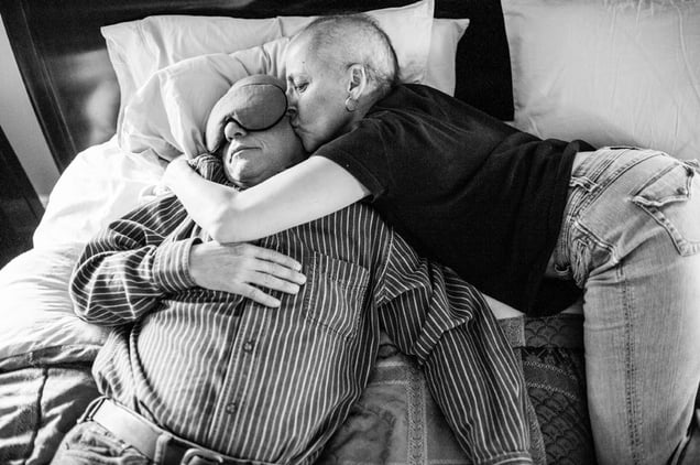 It’s a familiar afternoon scene around the Borowick home, with Howie fast asleep, exhausted from the week’s chemo and Laurel, his wife, waking him with a loving kiss on the forehead. Chappaqua, New York. March 2013 © Nancy Borowick