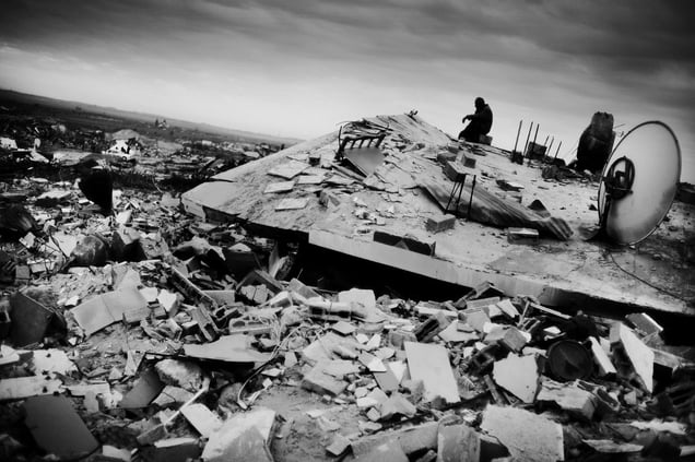 © Jan Grarup (Denmark) A man sitting on top of his house in the outskirts of Gaza city, January 2009. Beneath lies his entire family of seven people killed by bombs dropped by Israeli fighter planes. Honorable Mention, LensCulture Exposure Awards 2009