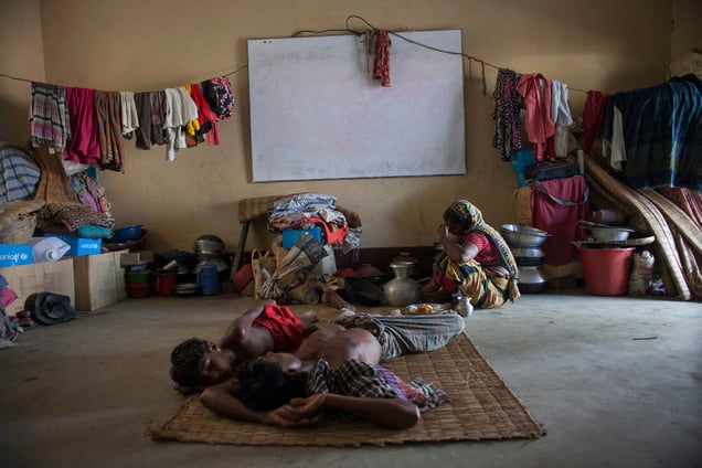 A flood affected family takes shelter at a school in Tala, Satkhira, Bangladesh